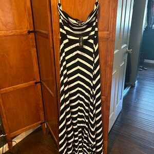 Strapless striped dress with a long high low.